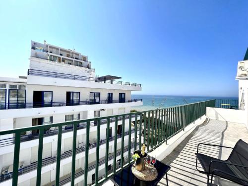 a cruise ship on the ocean with a balcony at Quarteira Ocean Breeze 1 With Pool by Homing in Quarteira