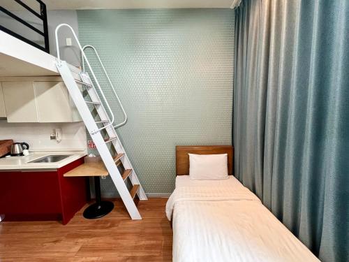 Ένα ή περισσότερα κρεβάτια σε δωμάτιο στο Myeongdong Merlin Hotel