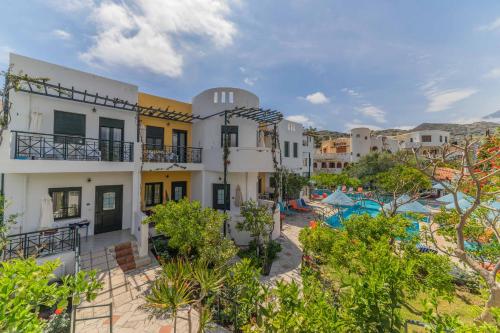 an image of a resort with a swimming pool at Kastro Studios Apartments in Myrtos