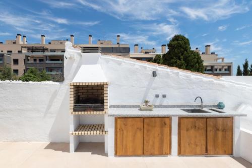 a kitchen on the roof of a building at Luxury Mauresque Jazmin in Torremolinos