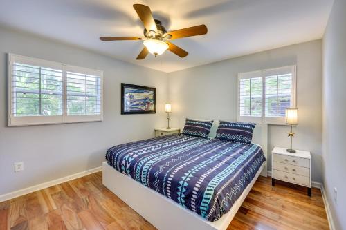 a bedroom with a bed and a ceiling fan at St Augustine Vacation Rental with Private Hot Tub! in Saint Augustine