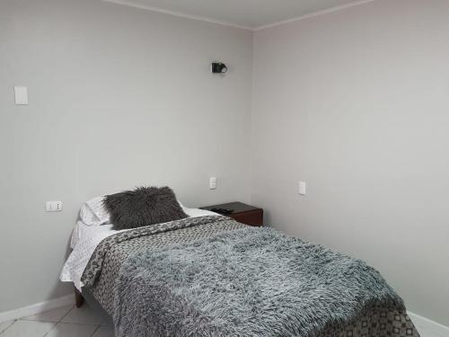 Postel nebo postele na pokoji v ubytování HABITACION BAÑO COMPARTIDO