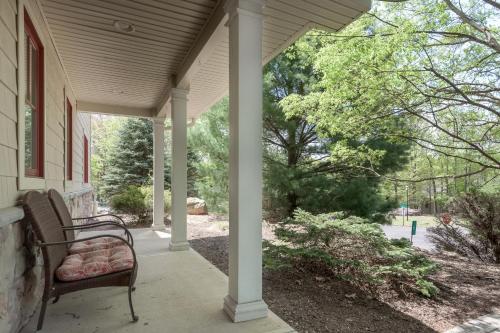 a porch with a bench on a house at 6 Fieldstone Ct in Lake Harmony