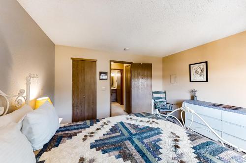a bedroom with a bed and a desk at The Pine Cone - Permit #3255 in Estes Park