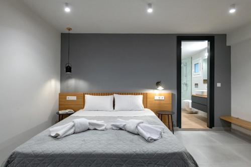 Postel nebo postele na pokoji v ubytování Traveleclectic Apartments