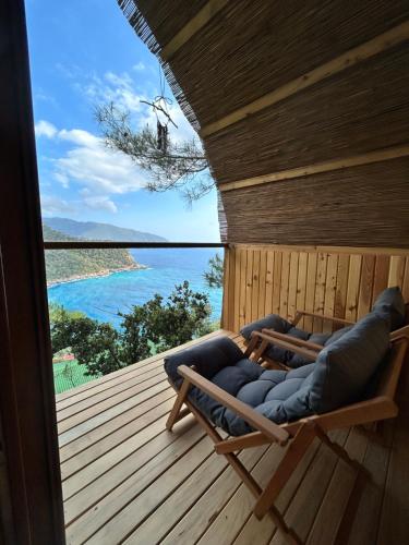 a room with a sauna with a view of the ocean at Kabak Ütopya Kamp in Faralya