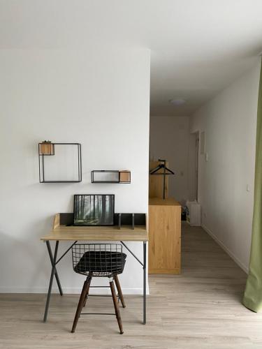 a desk and a chair in a room at Dream Apartments in Hohenems