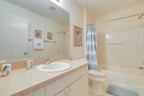 a bathroom with a sink and a toilet at Lanai and Golf Cart The Villages Vacation Rental! in The Villages