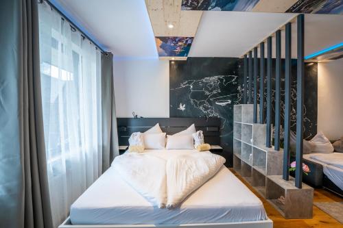 a bedroom with a bed and a large window at Modern Studio-Apartment in Gosau near Hallstatt in Gosau