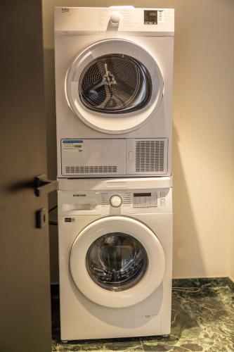 two machines are stacked on top of each other at Résidence Côté Sud in LʼÎle-Rousse