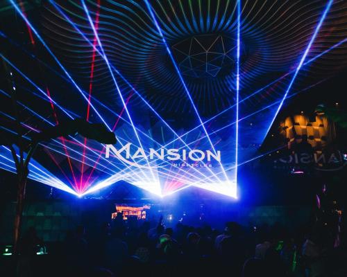 a stage with lasers and the transition sign on it at Paradox Vancouver in Vancouver