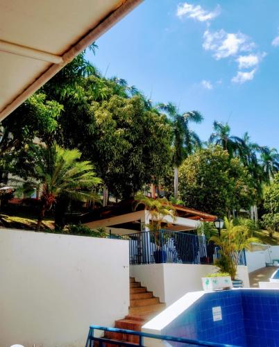 a view of a house with a white fence and stairs at Apartamento Girardot Resort in Girardot