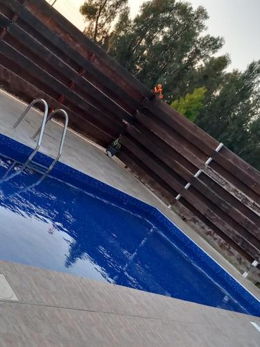 a swimming pool being painted blue at Sunset Villa in Nea Paphos
