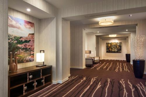 a hotel lobby with a large painting on the wall at Courtyard by Marriott Irvine Spectrum in Irvine