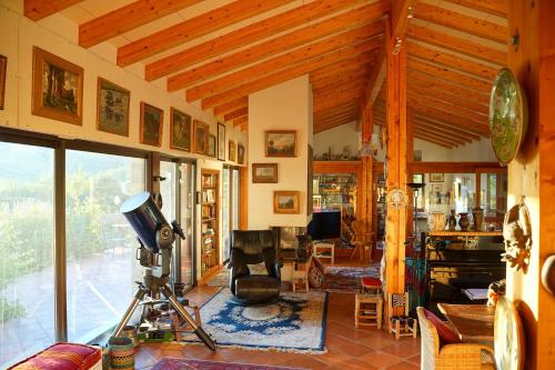 a living room with a television and a camera at Mas Companyo - Vallespir - Céret - Grand Mas in Céret