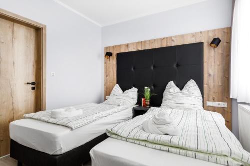 Postel nebo postele na pokoji v ubytování D & D Weserpension