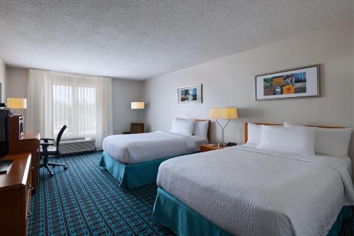 a hotel room with two beds and a desk at Fairfield Inn and Suites by Marriott McAllen in McAllen