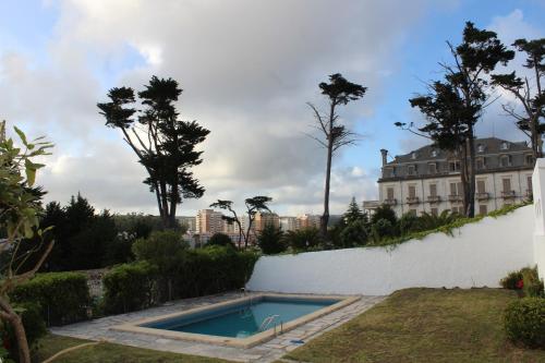 a swimming pool in the yard of a house at Boutique Inn & Restaurant - Casa dos Suécos in Figueira da Foz