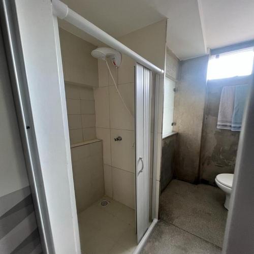 a bathroom with a shower and a toilet at STUDIO 204 | WIFI 600MB | RESIDENCIAL JC, um lugar para ficar. in Belém