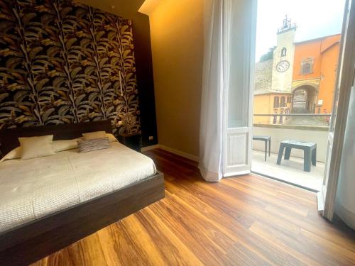 Postel nebo postele na pokoji v ubytování Palazzo Frigo