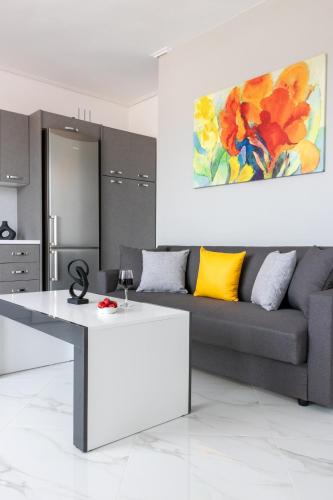 a living room with a couch and a table at Z5 Sky Sparta Apartment in Sparti