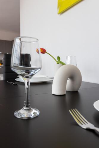 a wine glass sitting on top of a table at Z5 Sky Sparta Apartment in Sparti