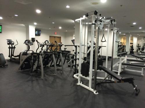 a gym with a bunch of treadms and machines at Century Plaza Hotel in Vancouver
