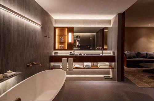 a bathroom with a bath tub and a sink at Hotel Fasano Sao Paulo Itaim in Sao Paulo