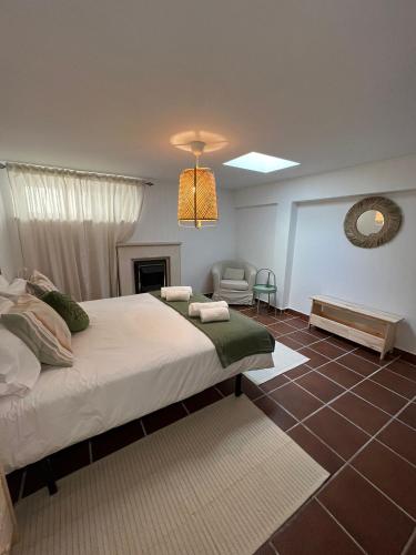 a bedroom with a bed and a living room at Coast Beach Apartment - Praia da Areia Branca in Praia da Areia Branca