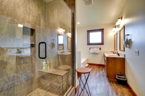 a bathroom with a shower and a sink and a stool at Sleek Red Lodge Home Rental with Private Hot Tub! in Red Lodge