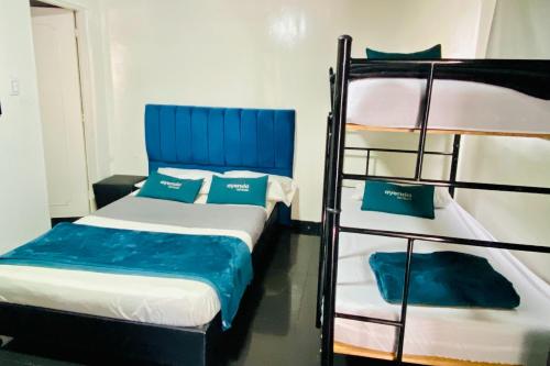 Cama o camas de una habitación en Hotel Bogota Home