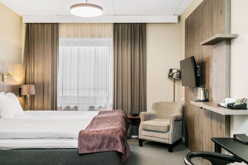 Postel nebo postele na pokoji v ubytování Best Western Ta Inn Hotel