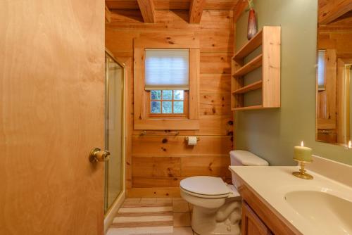 a bathroom with a toilet and a sink at Valle View in Valle Crucis