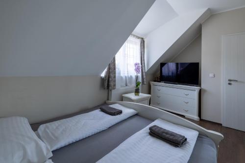 Katil atau katil-katil dalam bilik di Orchidea Apartman