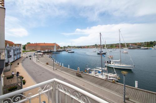 a view of a marina with boats in the water at Sunset Penthouse in Sønderborg
