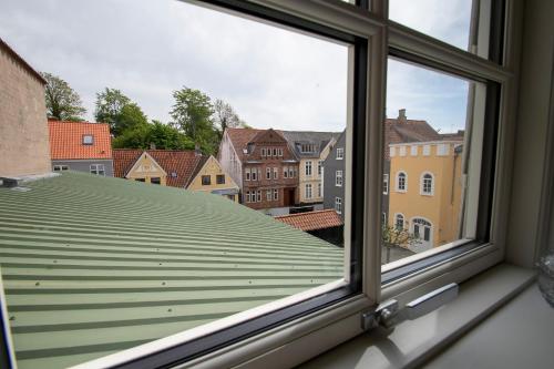 a view from a window of a roof at Sunset Penthouse in Sønderborg