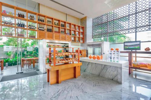 a store with a counter with bottles of wine at JW Marriott Pune in Pune