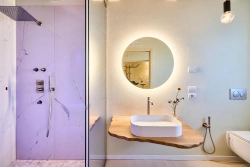 a bathroom with a sink and a mirror at Agriturismo Borgonuovo in Rimini