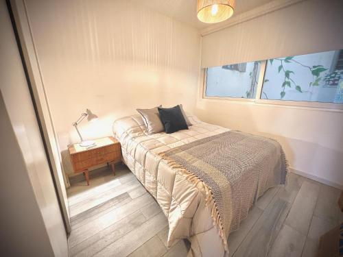 Un pat sau paturi într-o cameră la Exclusive Apartment in the Heart of Palermo Viejo PV1 by Apartments Bariloche