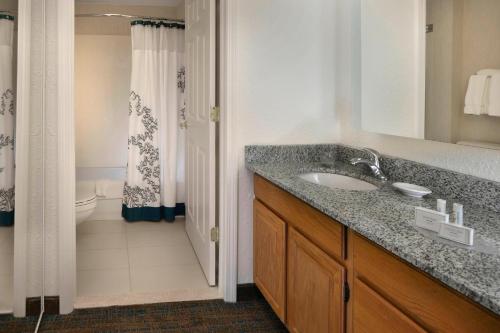 a bathroom with a sink and a toilet and a shower at Residence Inn Danbury in Danbury