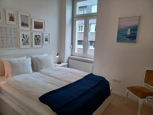 a bedroom with a large bed with a window at Apartment Calliope in Zagreb
