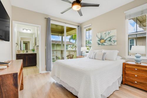 a bedroom with a bed and a ceiling fan at Nihilani at Princeville 19C in Princeville