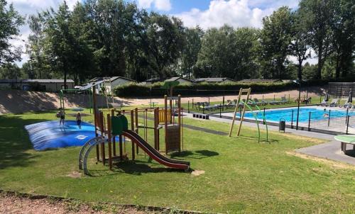 a playground with a slide in a park at Vakantie veluwe in Wageningen