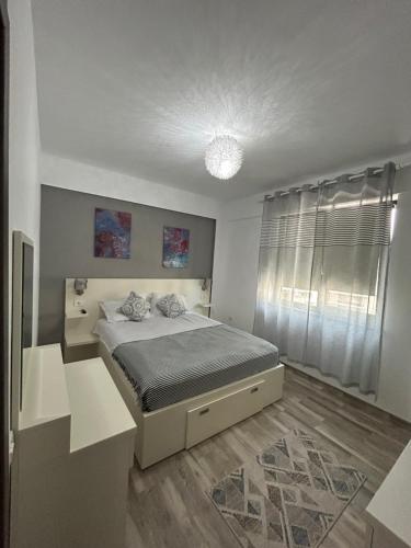 מיטה או מיטות בחדר ב-Apartament Sea