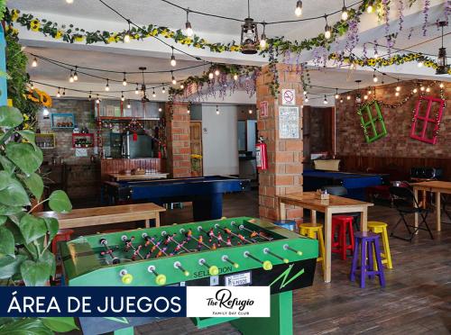 a restaurant with a foosball table in the middle at Hotel Pepe Pancho in San Cristóbal de Las Casas