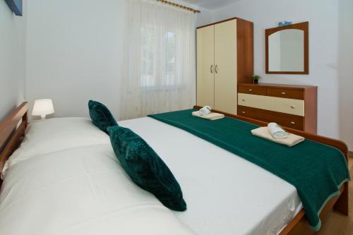 Ένα ή περισσότερα κρεβάτια σε δωμάτιο στο Forr Apartments - Hvar, Croatia