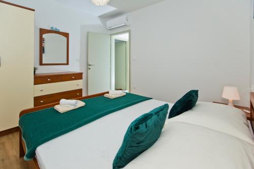 Ένα ή περισσότερα κρεβάτια σε δωμάτιο στο Forr Apartments - Hvar, Croatia