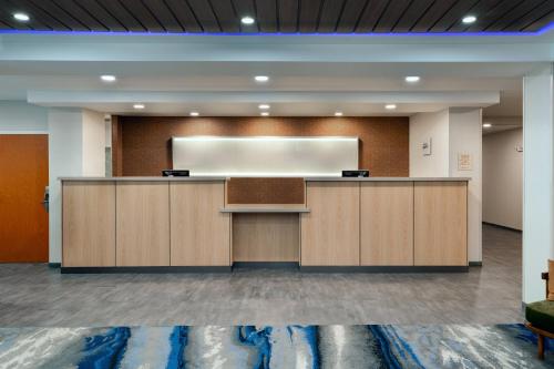 a lecture room with a podium and a screen at Fairfield Inn & Suites by Marriott Atlanta Stonecrest in Lithonia