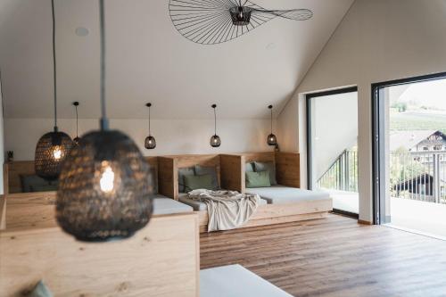 a room with two beds and a large window at Guesthouse Karnatsch in Parcines