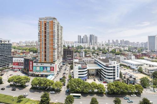 an aerial view of a city with tall buildings at Courtyard by Marriott Changsha South in Changsha